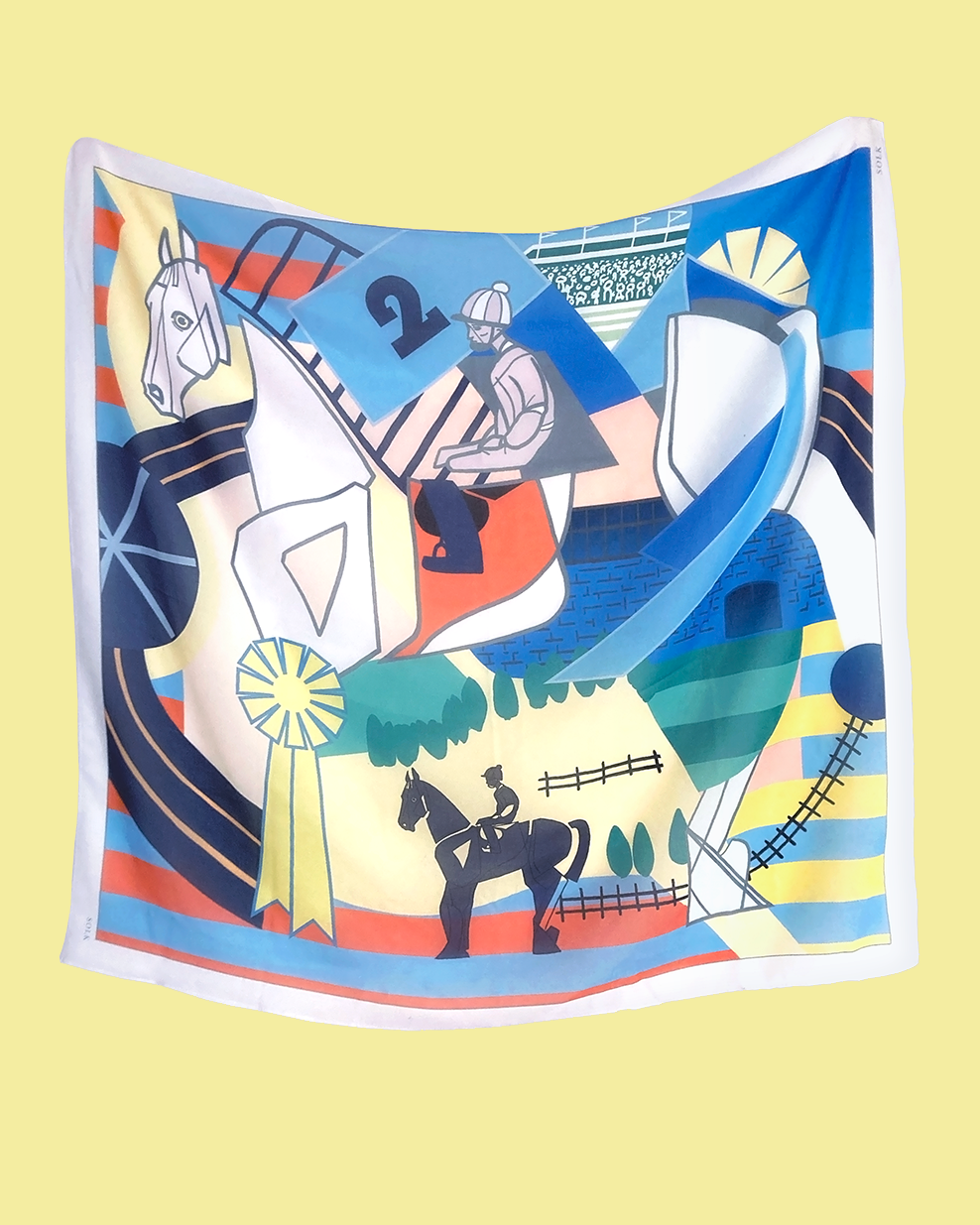 Colorful scarf with horse and rider design on a yellow background